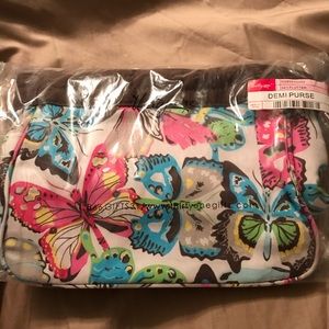 Thirty-One Demi Purse with a butterfly pattern.
